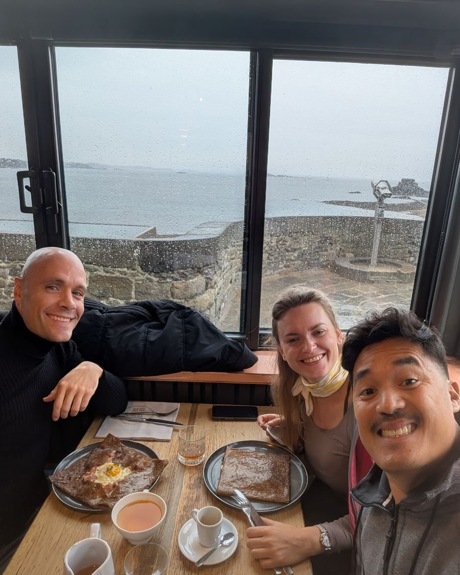 Crêpes by the window at Le Corps de Garde, rain on the sea