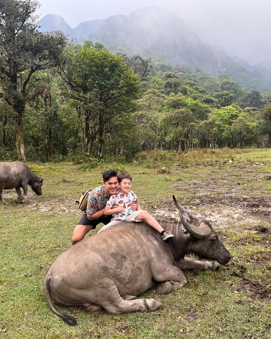 Vinh and Noah with a water buffalo in Sapa
